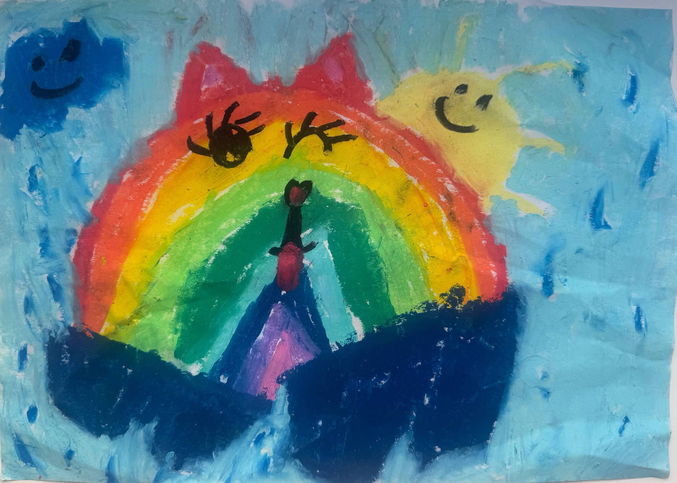 Child's acrylic painting of a rainbow shaped like a cat with closed eyes and red ears, with a small dancing figure beneath